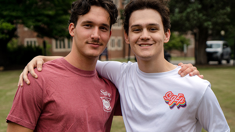 Close-up photo of two fraternity members